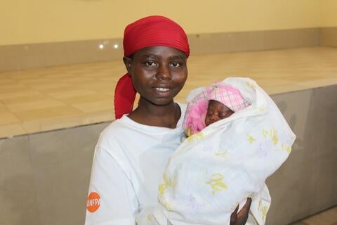 Virginie Nduwimana with her new born sharing her joy to be able to arise her baby